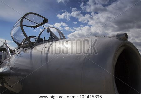 Detail of jet fighter aircraft with open cockpit