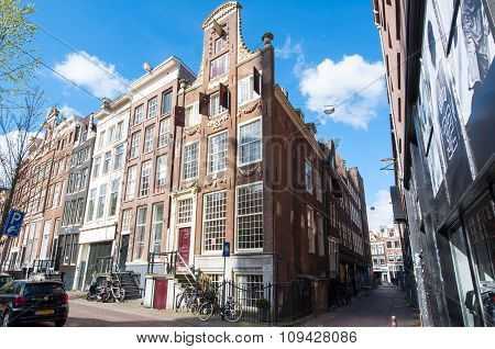 AMSTERDAMNETHERLANDS-APRIL 27: Tipical Amsterdam architecture and narrow street on April 27 2015 in Amsterdam Netherlands.
