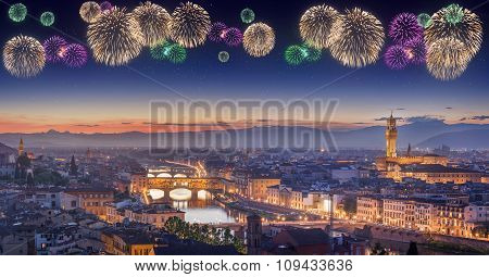 Beautiful fireworks under Arno River and Ponte Vecchio at sunset, Florence