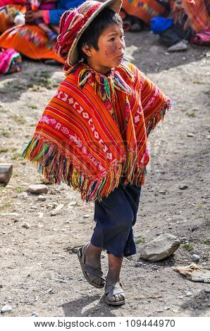 Quechua Boy With Hat In A Village In The Andes, Ollantaytambo, Peru