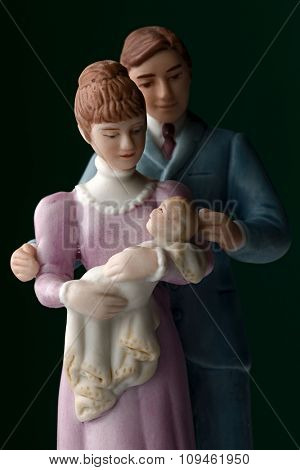 porcelan figurines of a family with baby