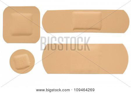 four shapes of adhesive bandage strips on white - with clipping path