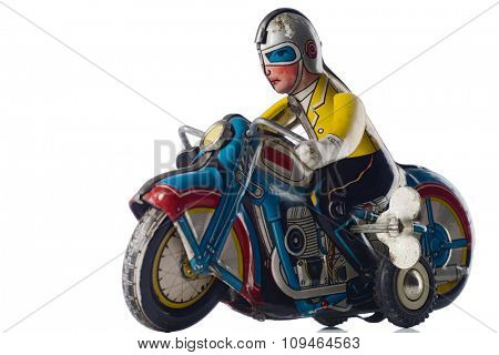 a windup tin toy - motorcyclist
