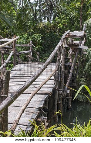 wooden pedestrian bridge across the river