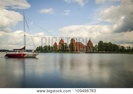 TRAKAI, LITHUANIA - JULY 20: Trakai castle by the lake in day light long exposure photo. July 2015