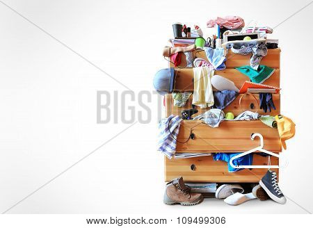 Mess, dresser with scattered clothes