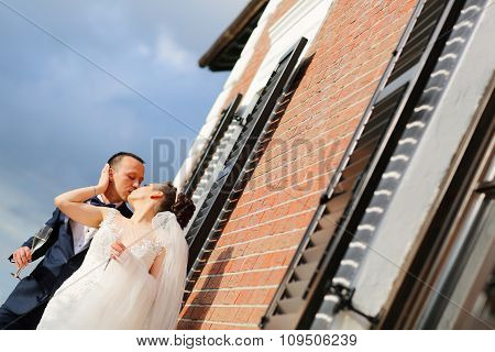 Beautiful Bridal Couple Celebratin With A Glass Of Champagne