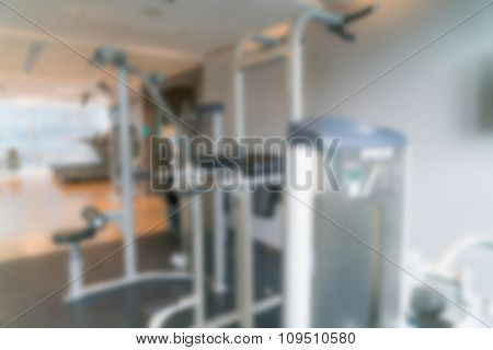 Abstract blur Fitness center with traineger equipments
