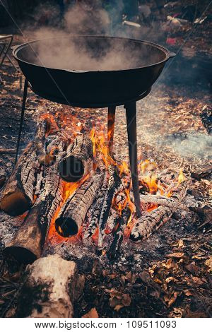 Cast Iron Pot Outdoors, Cooking On A Fire.