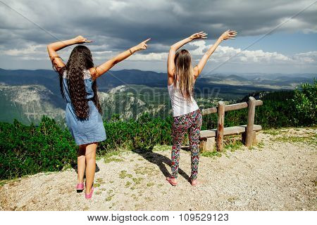 Two Girls Happy Dance On Peal Of Mountains