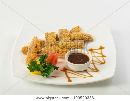 Sliced fish sticks and souce