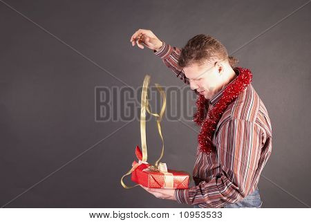 Man Opens A Gift