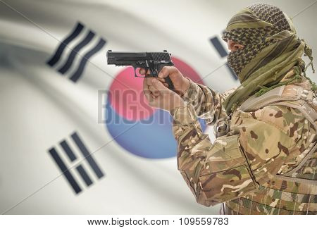 Male With Gun In Hand And National Flag On Background - South Korea