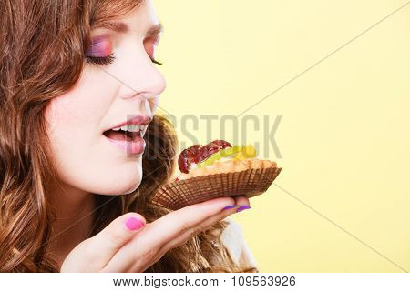 Woman Closed Eyes Holds Cake In Hand