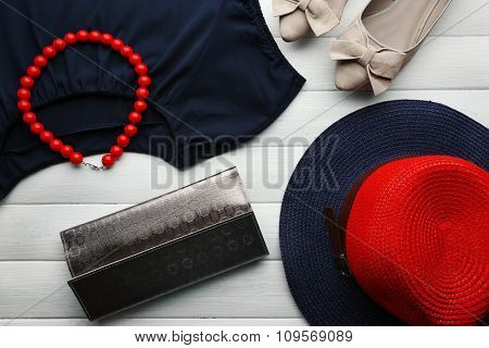 Composition of woman's fashion look on wooden background