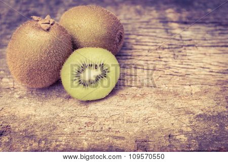 Close Up Fresh Kiwi Fruit On Old Wood Background.