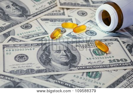 Yellow Tablet Scattered On The Bills Of 100 Dollars
