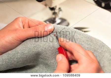 Hand Cut Open A Seam On The Fabric Knife For Ripping Seams