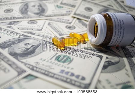 Yellow Tablet Scattered On The Bills Of 100 Dollars