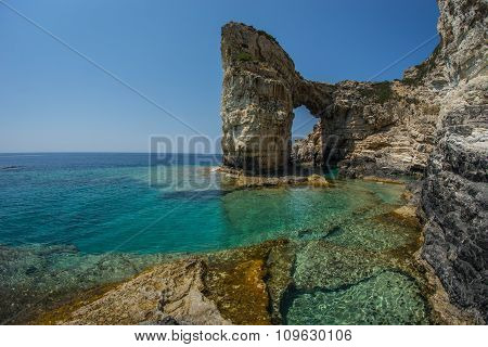 Unique And Scenic Arch In The Cliffs, Paxi, Greece