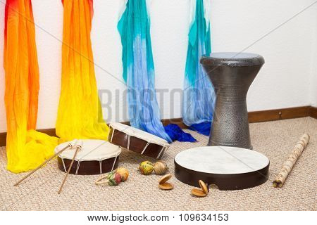 Traditional instruments on the floor.