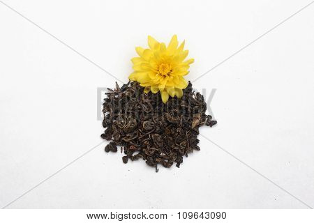 Tea leaves with yellow flower
