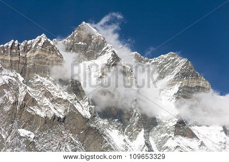 Top Of Lhotse And Nuptse With Clouds On The Top