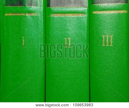 Volumes Of Old Books With Gold Lettering On The Cover