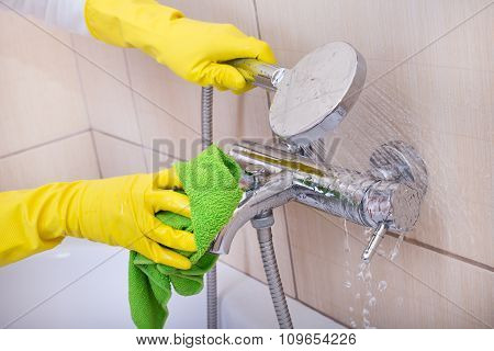Woman Cleaning Bathtub