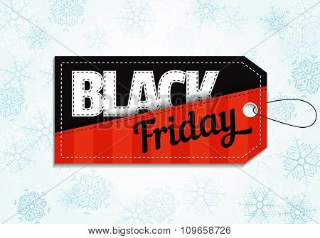 Black Friday sales tag on snowflake background.