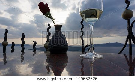 A Vine Glass And A Rose On Greece Island
