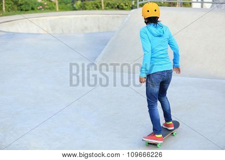 skateboarder woman skateboarding at skatepark