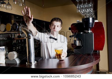 Young Handsome Bartender Waiting An Order.