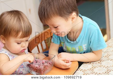Children Eating Quick-frozen Raspberries