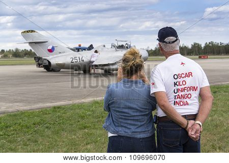 Former Owner, Collector Tom Smith Looking At Jet Fighter Aircraft Mikoyan-gurevich Mig-15 Standing O