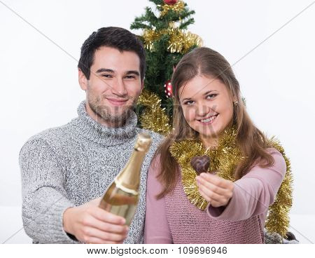 Young Couple And Christmas Tree