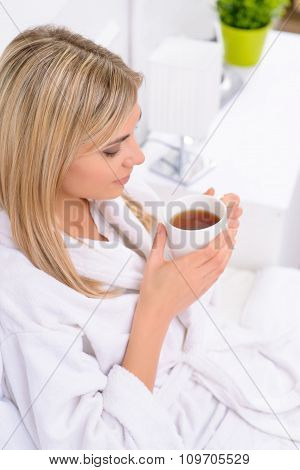 Hotel resident drinking her tea.