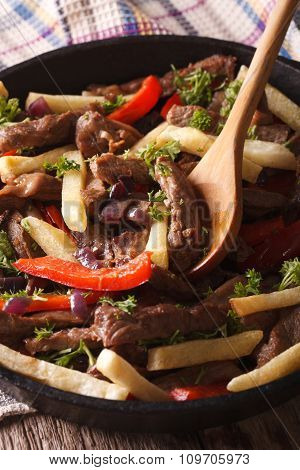 Homemade Peruvian Food: Lomo Saltado Close-up In A Pan. Vertical