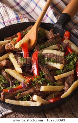 Beef With Vegetables - Lomo Saltado Close-up In A Pan. Vertical