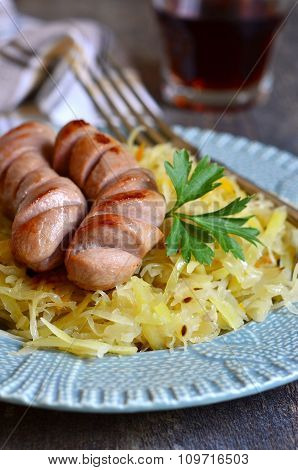 Sour Cabbage Stew With Grilled Sausage.