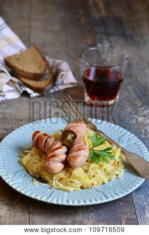 Sour Cabbage Stew With Grilled Sausage.