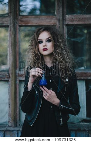 Vintage witch with elixir in hand
