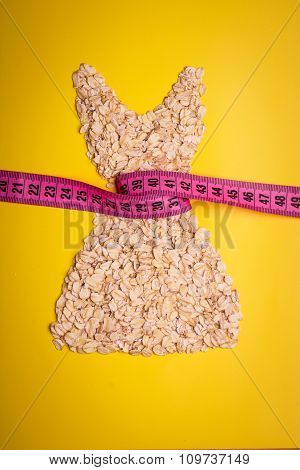 Dress Shape Made From Oatmeal With Measuring Tape