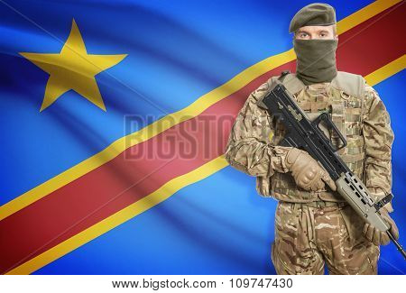 Soldier Holding Machine Gun With Flag On Background Series - Congo-kinshasa