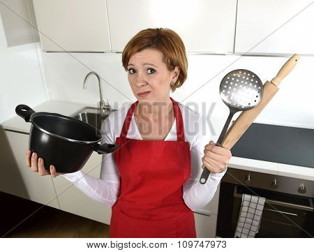 Rookie Home Cook Woman In Red Apron At Home Kitchen Holding Cooking Pan And Rolling Pin Sad In Stres