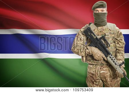 Soldier Holding Machine Gun With Flag On Background Series - Gambia
