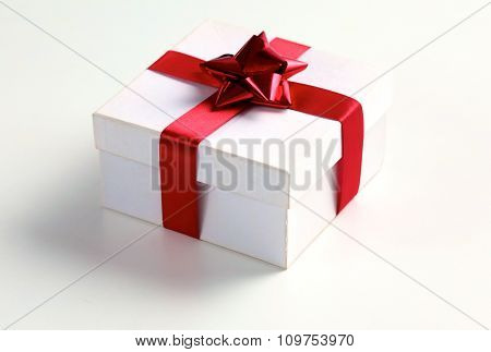 New Year gift on a golden tinsel background boly