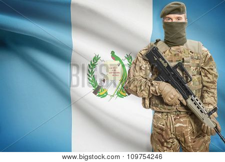 Soldier Holding Machine Gun With Flag On Background Series - Guatemala