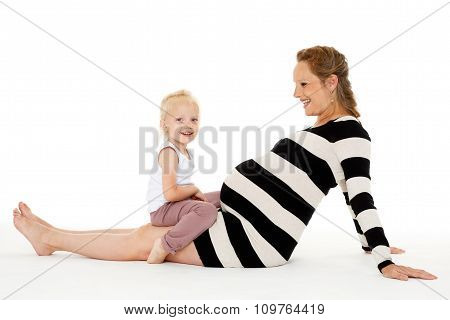 Happy Pregnant Woman With Daughter.