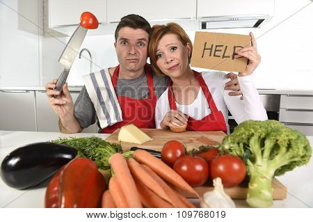 American Couple In Stress At Home Kitchen In Cooking Apron Asking For Help Frustrated